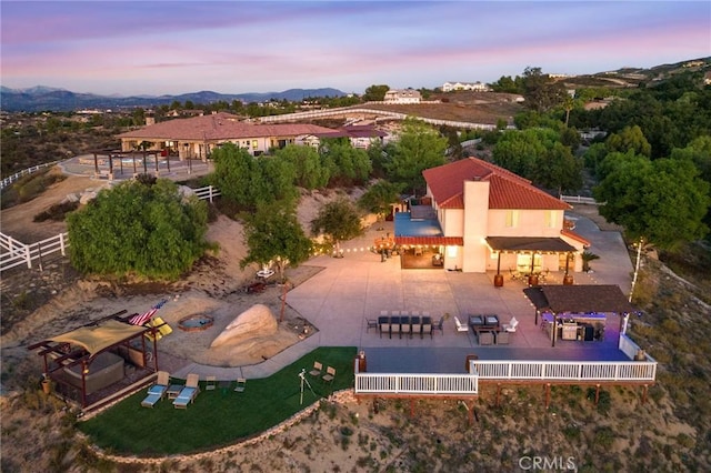 aerial view at dusk with a mountain view