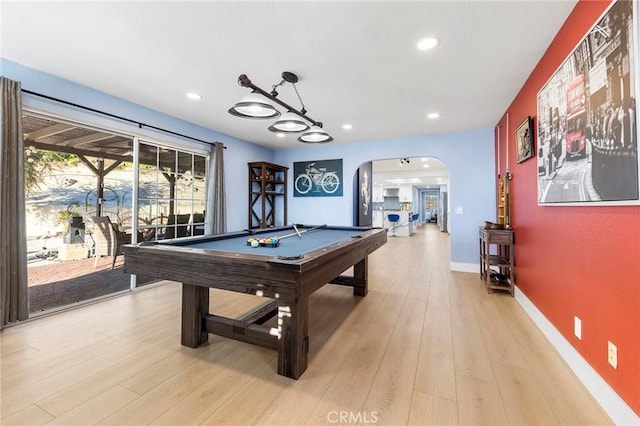 rec room featuring arched walkways, recessed lighting, pool table, light wood-style floors, and baseboards