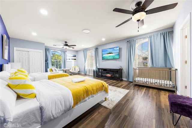 bedroom with baseboards, ceiling fan, wood finished floors, a closet, and recessed lighting