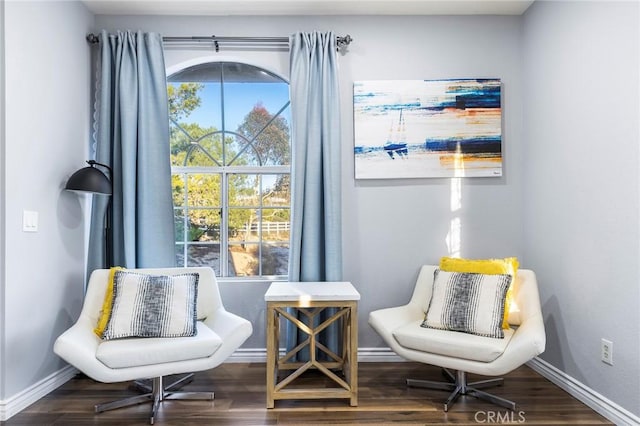 sitting room featuring wood finished floors and baseboards