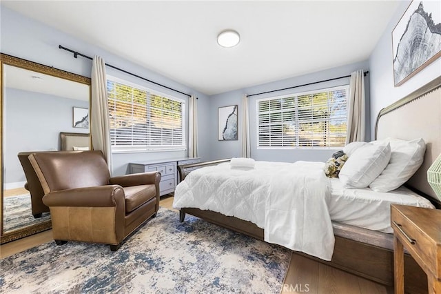 bedroom with wood finished floors