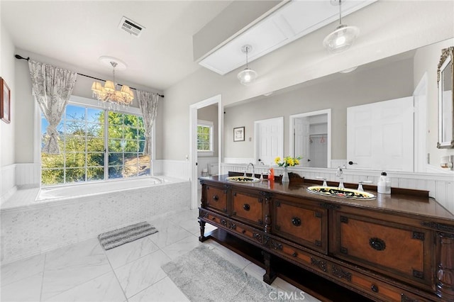 full bathroom featuring marble finish floor, double vanity, a sink, and visible vents