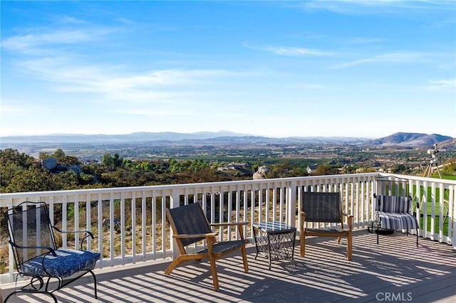 wooden terrace featuring a mountain view