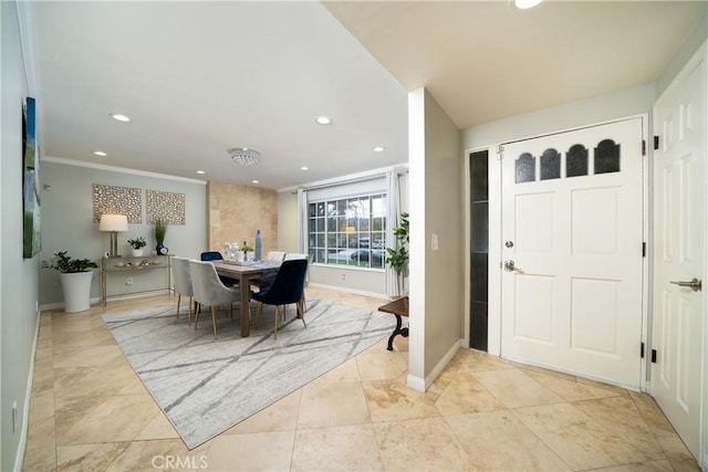 entrance foyer with recessed lighting, baseboards, and crown molding