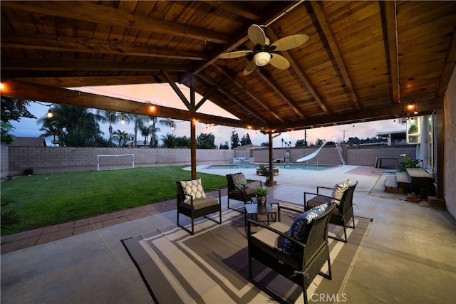 view of patio with a fenced in pool, an outdoor hangout area, and a fenced backyard