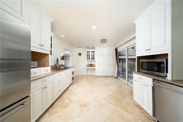 kitchen with white cabinetry, recessed lighting, and appliances with stainless steel finishes