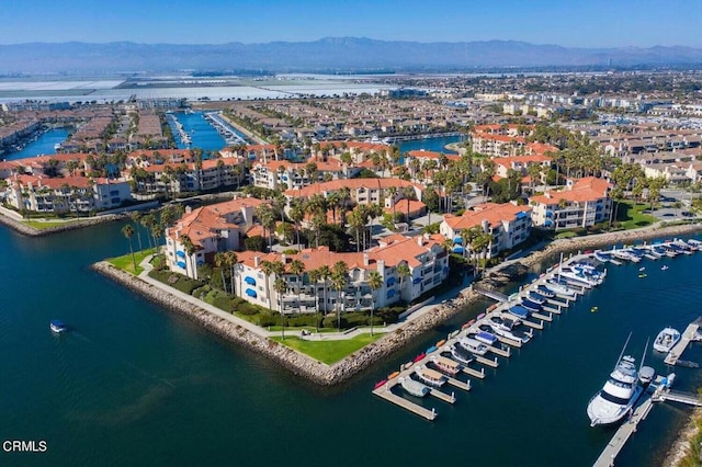 birds eye view of property featuring a water and mountain view