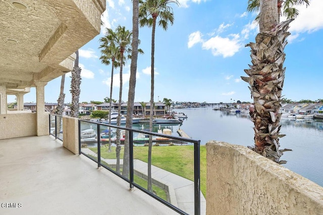 exterior space with a water view and a balcony