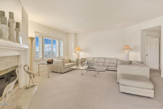 living room with carpet and a tiled fireplace