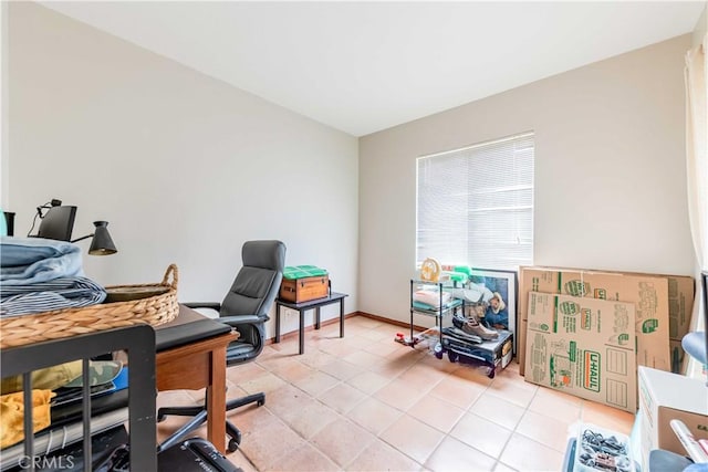 office space with light tile patterned floors and baseboards