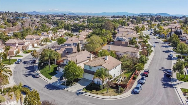 birds eye view of property with a mountain view and a residential view