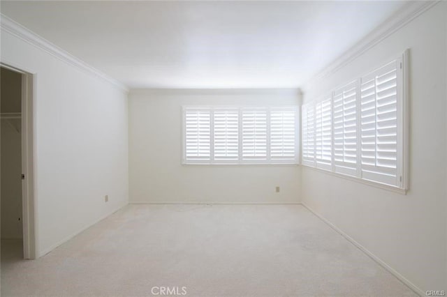 unfurnished bedroom with carpet flooring and crown molding