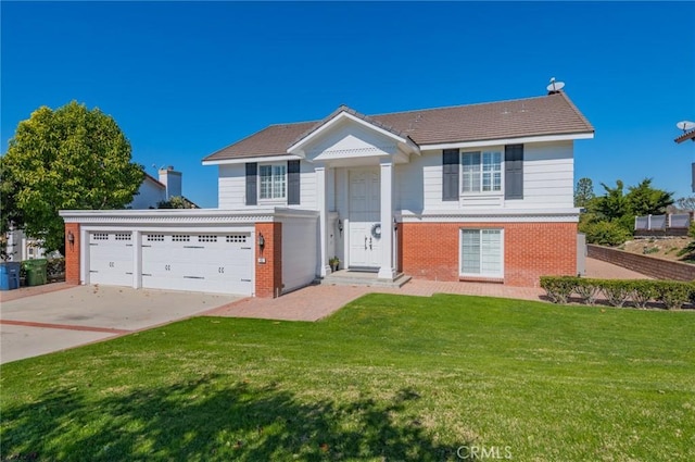 view of front of house with concrete driveway, brick siding, and a front lawn