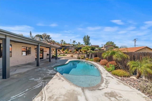 view of pool featuring a patio area, fence, and a fenced in pool