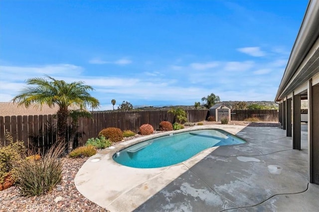 view of pool with a fenced in pool, a fenced backyard, and a patio