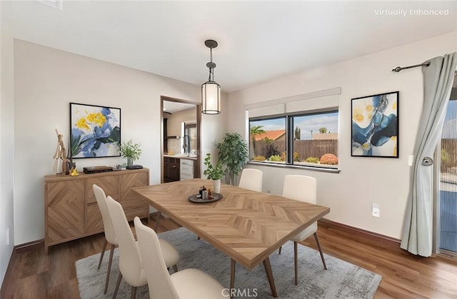 dining area with wood finished floors