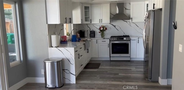 26734 Caravan Cir, Corona, CA 92883 - kitchen featuring wall chimney exhaust hood, stainless steel appliances, healthy amount of natural light, and decorative backsplash