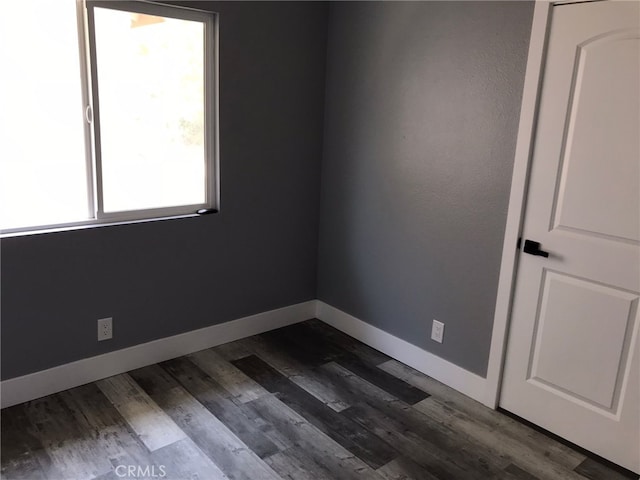 26734 Caravan Cir, Corona, CA 92883 - empty room with baseboards and dark wood-style floors