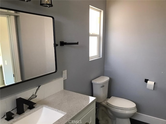 26734 Caravan Cir, Corona, CA 92883 - half bathroom featuring vanity, toilet, and baseboards