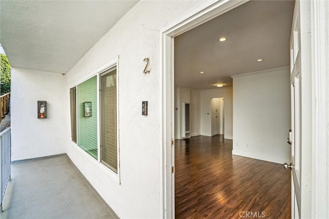 doorway to property with stucco siding and a balcony