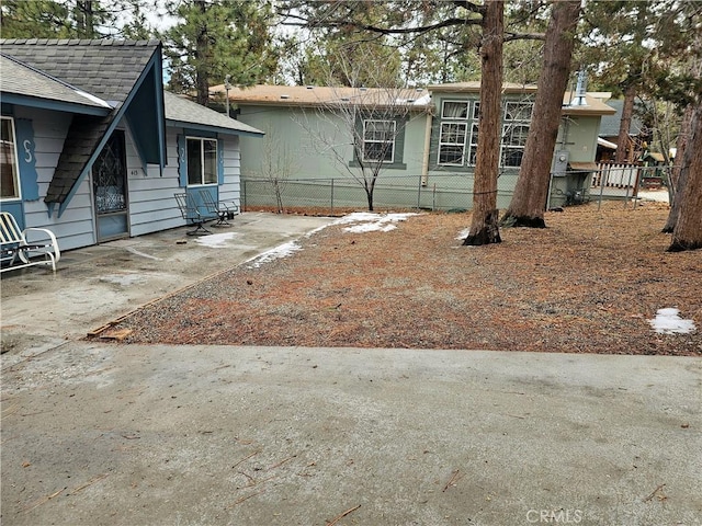 exterior space featuring a patio area and fence