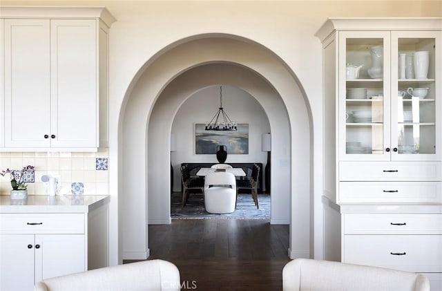 hallway featuring dark wood-style flooring