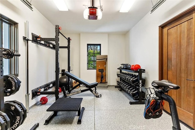 workout area with a garage