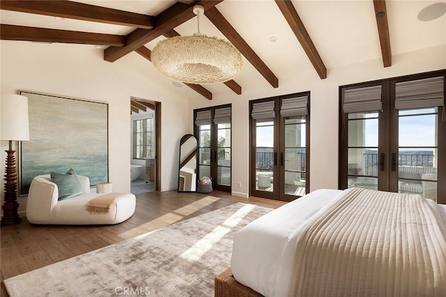 bedroom featuring hardwood / wood-style floors, access to exterior, lofted ceiling with beams, and french doors