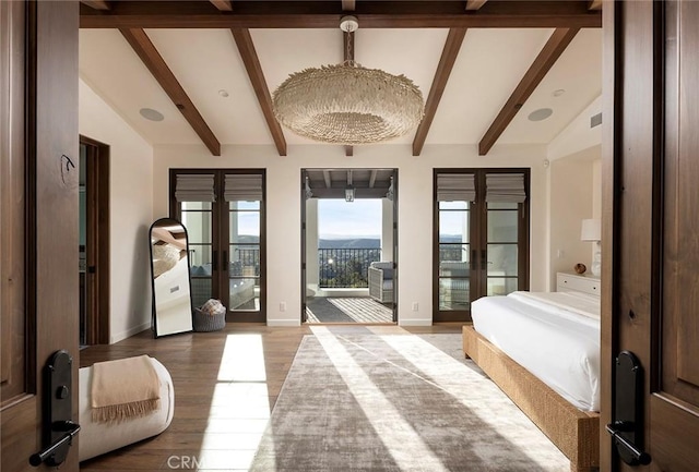 entryway with visible vents, baseboards, lofted ceiling with beams, french doors, and light wood-style floors