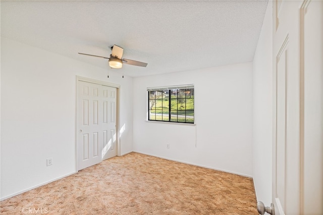 43317 Running Deer Ct, Coarsegold, CA 93614 - unfurnished bedroom with carpet flooring, a closet, ceiling fan, a textured ceiling, and baseboards
