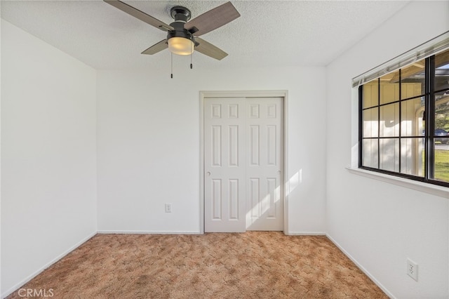 43317 Running Deer Ct, Coarsegold, CA 93614 - unfurnished bedroom with carpet floors, a closet, baseboards, a textured ceiling, and a ceiling fan