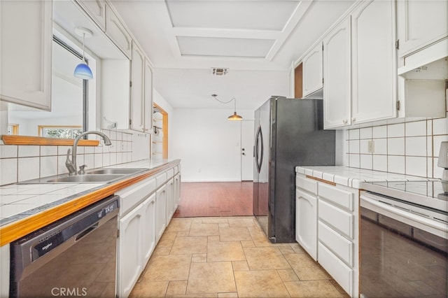 43317 Running Deer Ct, Coarsegold, CA 93614 - kitchen featuring appliances with stainless steel finishes, tile countertops, white cabinets, and a sink
