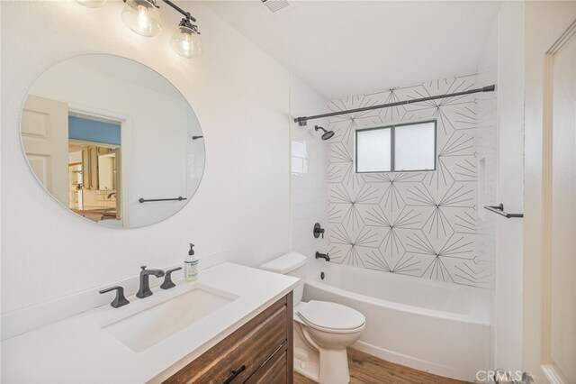 full bath with visible vents, shower / washtub combination, toilet, and vanity