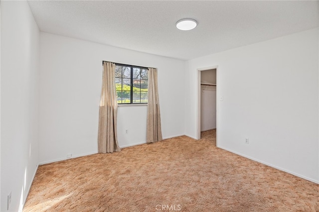 43317 Running Deer Ct, Coarsegold, CA 93614 - unfurnished bedroom featuring carpet flooring, a walk in closet, and baseboards