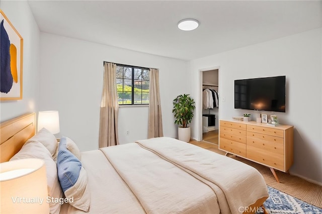 43317 Running Deer Ct, Coarsegold, CA 93614 - bedroom with a walk in closet and baseboards
