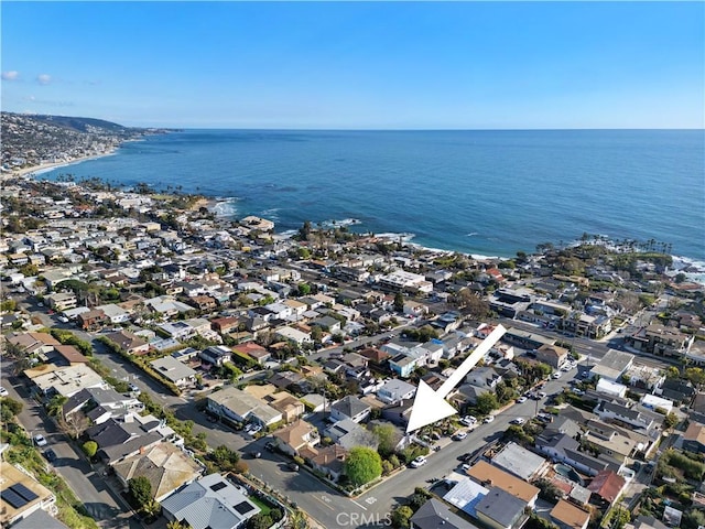 birds eye view of property featuring a water view and a residential view