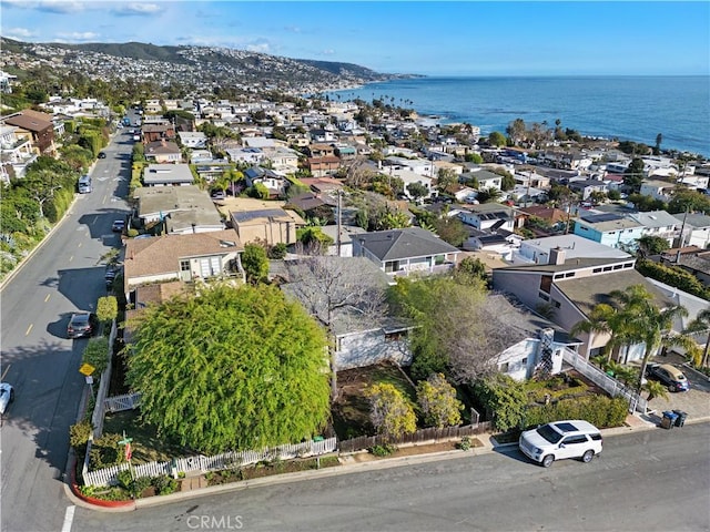 birds eye view of property with a residential view and a water view