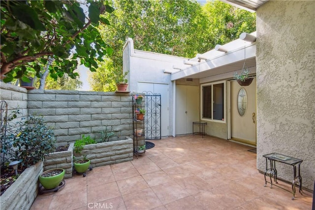 view of patio featuring fence