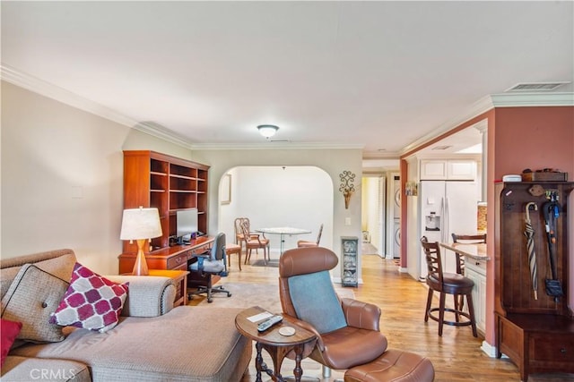 3001C Via Buena Vis Unit C, Laguna Woods, CA 92637 - living room featuring light wood-style floors, ornamental molding, and arched walkways