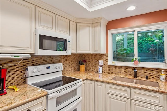 3001C Via Buena Vis Unit C, Laguna Woods, CA 92637 - kitchen featuring white appliances, a sink, backsplash, and light stone counters