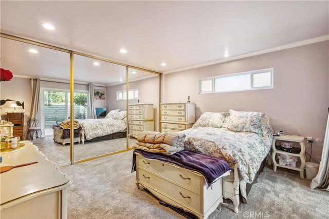 bedroom with carpet, multiple windows, and ornamental molding
