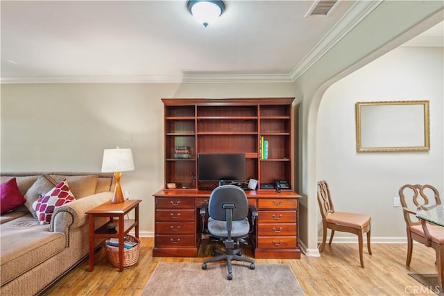 office area featuring crown molding, baseboards, visible vents, and light wood-style floors