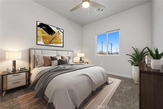 bedroom with a ceiling fan, visible vents, dark carpet, and baseboards