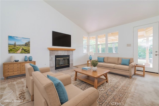 living room featuring a fireplace, high vaulted ceiling, and light colored carpet