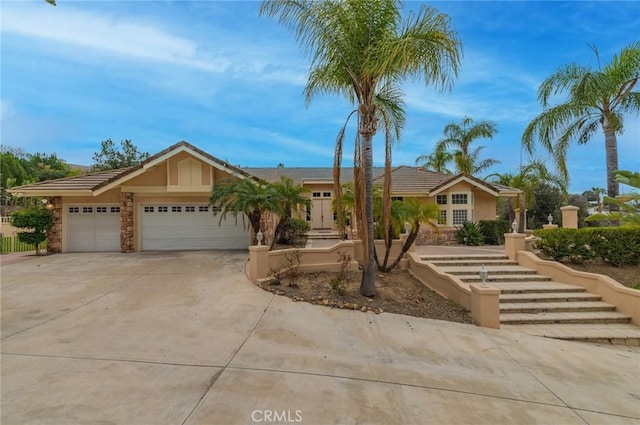 view of front facade with a garage and concrete driveway