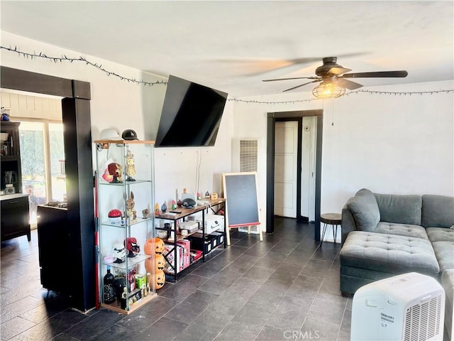 living room with visible vents and a ceiling fan