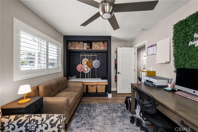 office space with wood finished floors and a ceiling fan