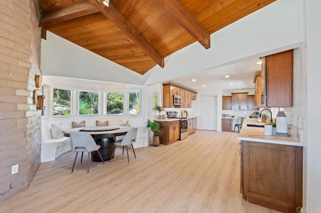 dining room featuring light wood finished floors, beamed ceiling, recessed lighting, wooden ceiling, and high vaulted ceiling