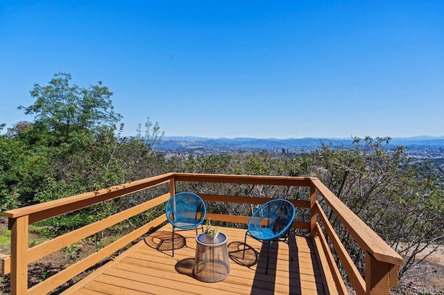 wooden terrace with a mountain view