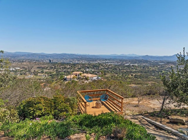 birds eye view of property with a mountain view